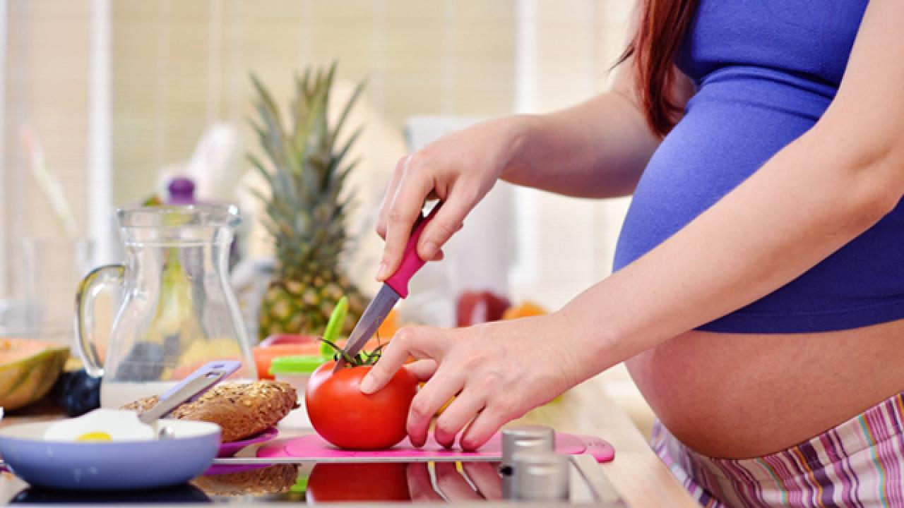pregnant preparing food